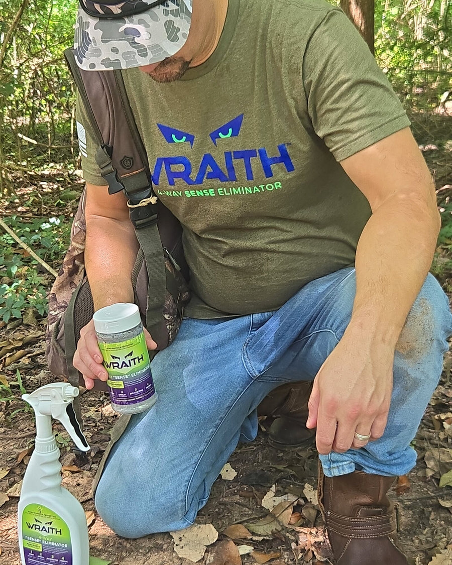 In the field: a hunter measuring WRAITH powder from the 32 oz bulk canister on the forest floor